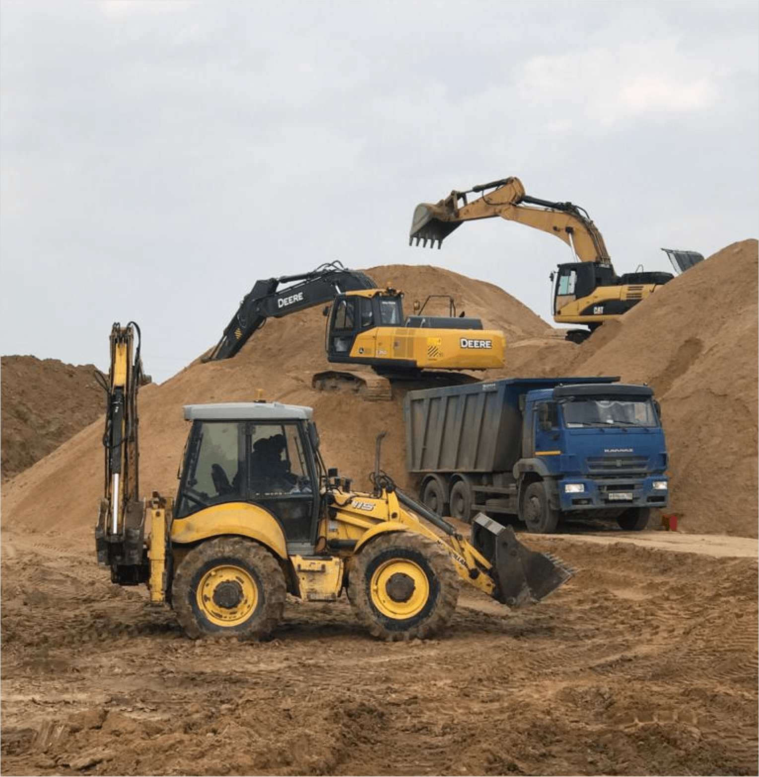 construction machinery located among the sand